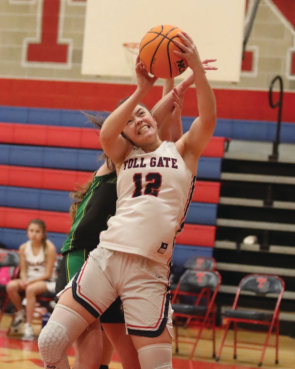 LOOKING TO REBOUND: Toll Gate’s Adeline Areson hauls in a rebound on Monday night. (Photos by Mike Zawistoski)